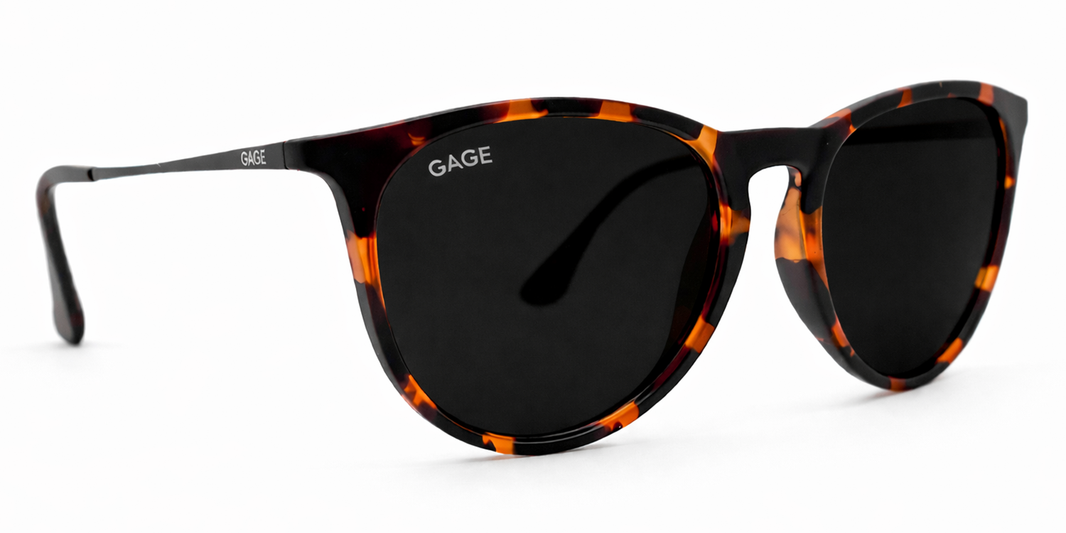 Sunglasses with tortoiseshell frame and black lenses on a white background