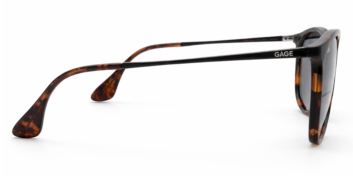 Sunglasses with tortoiseshell frame and black arms on a white background