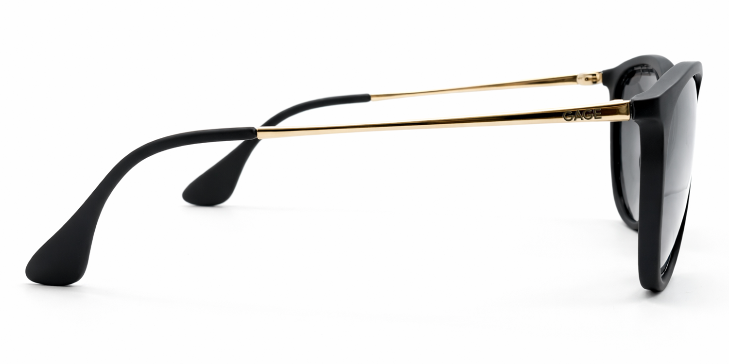 Black sunglasses with gold frames on a white background