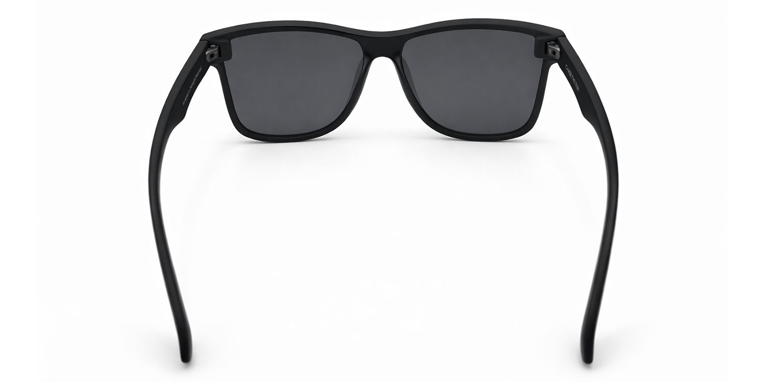 Black sunglasses with dark lenses on a white background