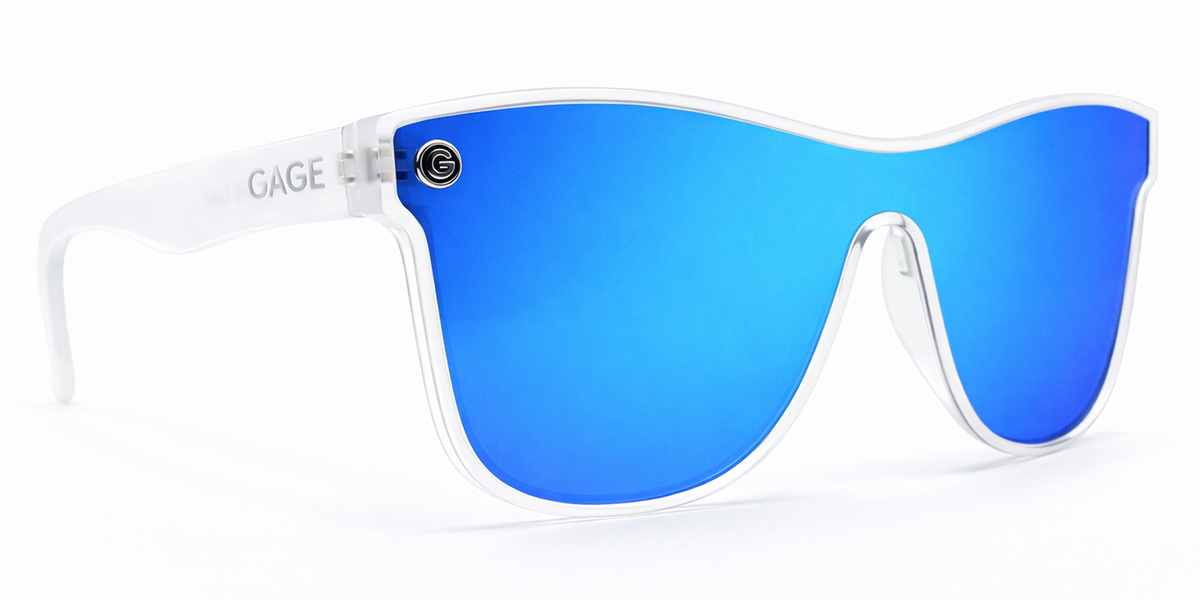 Sunglasses with blue reflective lenses and clear frame on a white background
