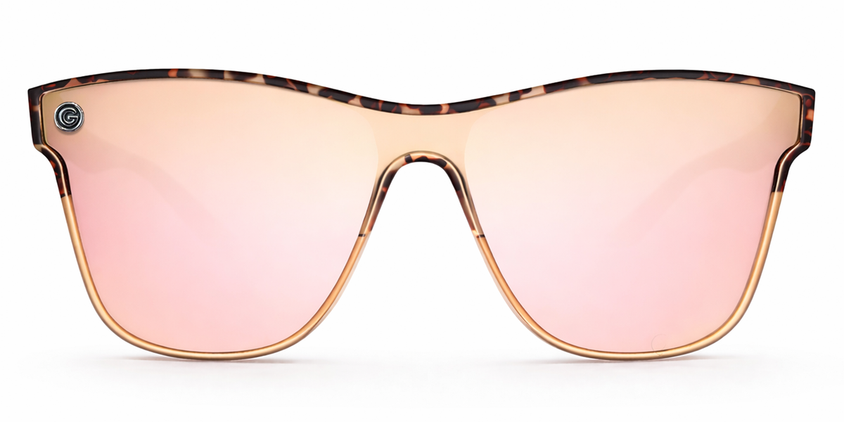Sunglasses with a tortoiseshell frame and champagne lenses on a white background
