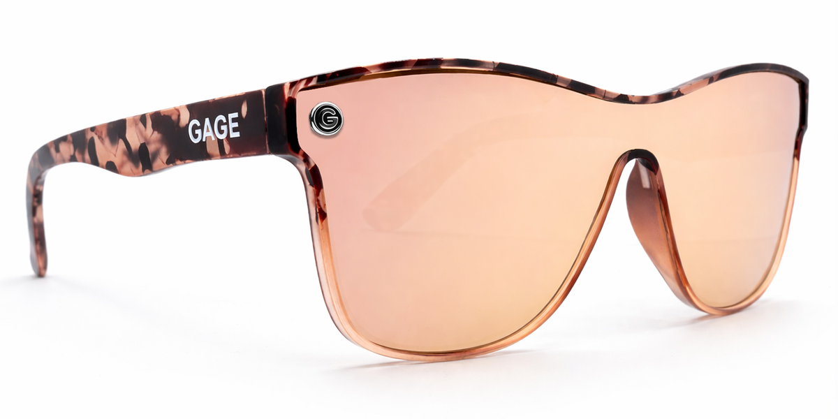Sunglasses with a tortoiseshell frame and champagne lenses on a white background