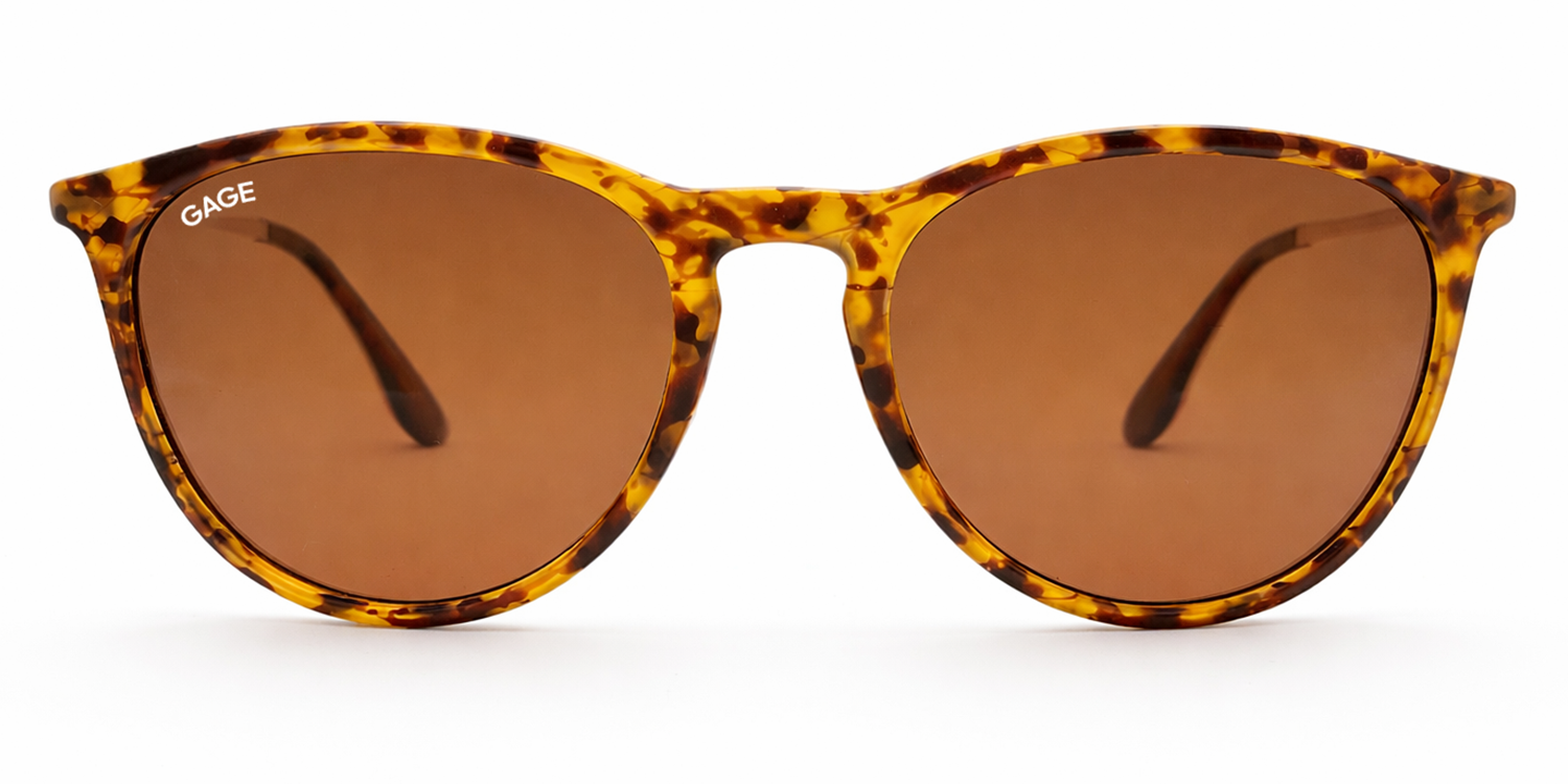 Sunglasses with tortoiseshell frame and brown lenses on a white background