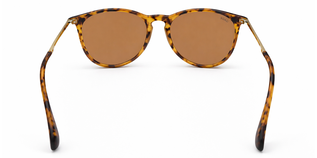Sunglasses with tortoiseshell frame and brown lenses on a white background