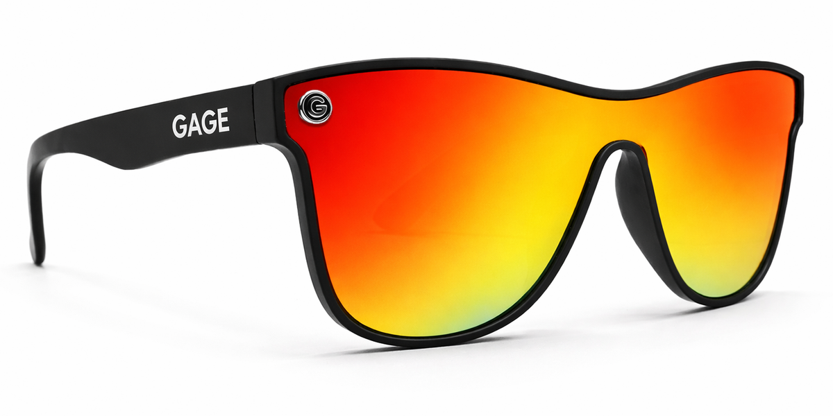 Sunglasses with black frame and red-orange gradient lenses on a white background