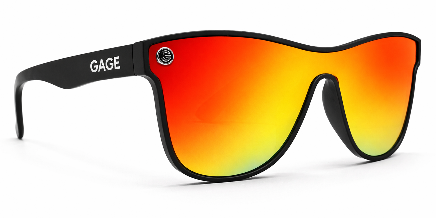 Sunglasses with black frame and red-orange gradient lenses on a white background